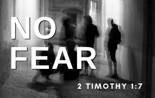 A distorted picture of people in the shadows with the words "No fear" in the foreground.