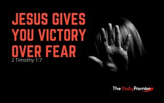 Person with Hand up - "Jesus Gives you Victory Over Fear" - 2 Timothy 1:7