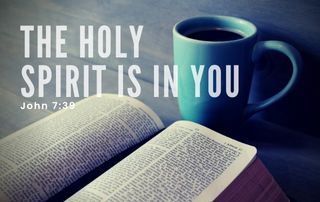 Bible with a blue cup of coffee. "The Holy Spirit is in You" John 7:39