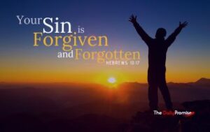 Person with hands raised. Your sin is forgiven and forgotten - Hebrews 10:17