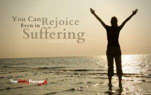 Man with hands raise - "You Can Rejoice Even in Suffering"