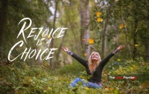 Woman with hands raise in joy. "Rejoice is a Choice" - Philippians 4:4