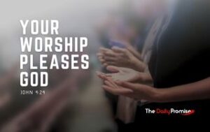 A person with their hands raised in worship. "Your Worship Pleases God" - John 4:24