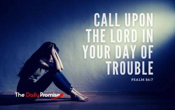 A woman sitting with her head in her hands. "Call upon the Lord in Your Day of Trouble" - Psalm 86:7