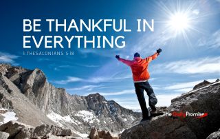 Man standing in the mountains with hands raised - "Be Thankful in Everything"