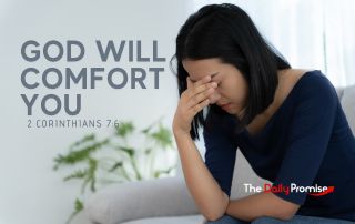 A woman with her head down and her hand against her sad face "God Will Comfort You" 2 Corinthians 7:6