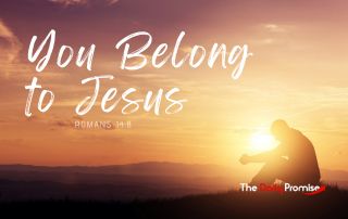 A man sitting in front of a sunset with the words "You Belong to Jesus"