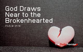 A broken, read heart is sitting on a dark gray background - God Draws Near to the Brokenhearted - Psalm 34:18