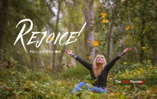 Woman with hands raise in joy. "Rejoice!" - Philippians 4:4