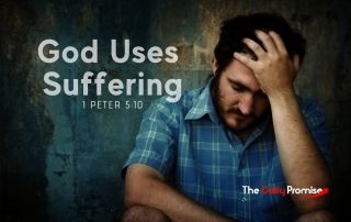 A man with a blue shirt is holding his head in his hand. "God uses suffering."