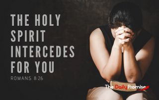 A woman with hands clasps on an open Bible in prayer. "The Holy Spirit Intercedes for You."