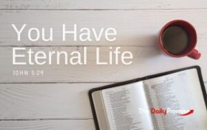 A Bible laying on whitewashed wood with a cup of coffee - You Have Eternal Life"