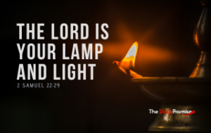 An oil lamp with a flame burning and spreading light against a black background. "God is Your Light and Lamp" - 2 Samuel 22:29