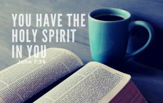 A Bible with a blue cup of coffee. "You Have the Holy Spirit in You" John 7:39