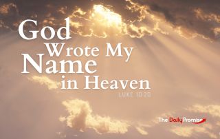 A picture of clouds with the sun breaking through. "God Wrote My Name in Heaven"