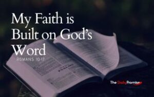 An open Bible with a dark background. The text reads - My Faith is Build on God's Word. - Romans 10:17