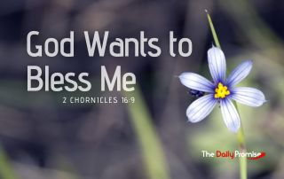 A blooming white and blue flower with the words "God Wants to Bless Me" in the foreground.