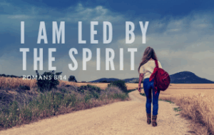 A young woman is walking down a road. "I Am Led by the Spirit - Romans 8:14