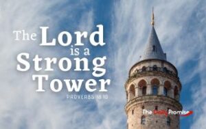 The tower of a castle against a blue sky with whispery white clouds. "The Lord is a Strong Tower." - Proverbs 18:10