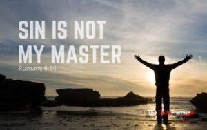 A man with hands raised against a sunset. "Sin is Not My Master" - Romans 6:14