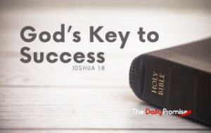 A black Bible lying on light gray wood. "God's Key to Success" is the title