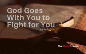 A long sword, resting on a table. You can only see the handle and part of the blade. "God Goes With You to Fight for You"
