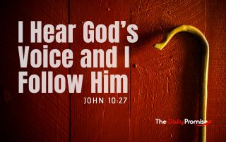 A Shepherd's staff on a dark red wooden background. The title in white reads, "I Hear God's Voice and I Follow Him."