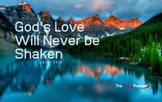 A lake with mountains in the background. "God's Love Will Never be Shaken" Isaiah 54:10