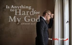 A man leaning on a wall, looking out a window. "Is Anything too Hard for My God" Jeremiah 32:27