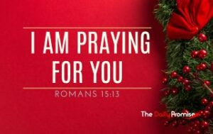 A red background with holly on the right side. "I Am Praying for You" Romans 15:13