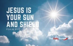 A blue sky with scattered clouds and the sun shining through. "Jesus is Your Sun and Shield. - Psalm 84:11