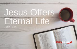 A Bible laying on whitewashed wood with a cup of coffee - "Jesus Offers Eternal Life"