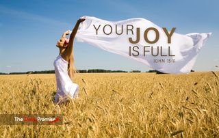 A woman walking through a wheat field with a white sheet above her head is blown by the wind. The title reads: Your Joy is Full
