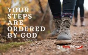A close-up of walking boots along a narrow path. The lettering reads, "Your Steps are Ordered by God."