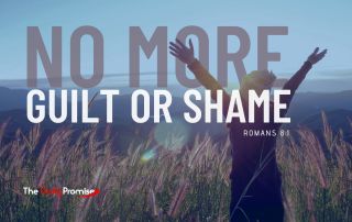 A woman standing in a field with her hands lifted in praise. - "No More Guilt or Shame" - Romans 8:1