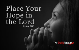 A woman praying with her eyes lifted, on ablack background - Place Your Hope in the Lord - Psalm 31:24