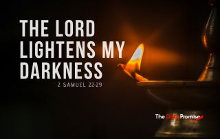 An oil lamp with a flame burning and spreading light against a black background. "The Lord Lightens My Darkness" - 2 Samuel 22:29