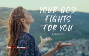 A woman with hands raised in prayer, "Your God Fights for You" - Romans 8:31