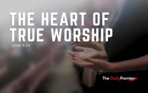 A person with their hands raised in worship. "The Heart of True Worship" - John 4:24