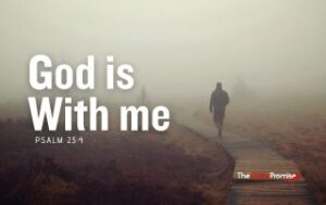 A man is walking along a wooden path in deep fog. "God is With Me" - Psalm 23:4