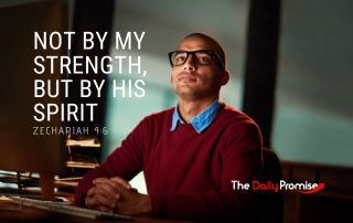 A man in a burgundy sweater looking up. "Not by My Strength, but by His Spirit"
