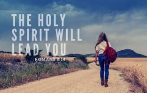 A woman walking down a road. "The Holy Spirit Will Lead You"