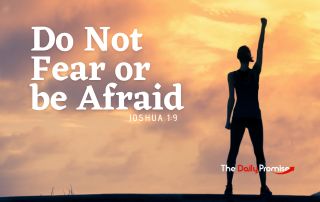 A Woman with a victorious hand raised in the air. "Do Not Fear or be Afraid"
