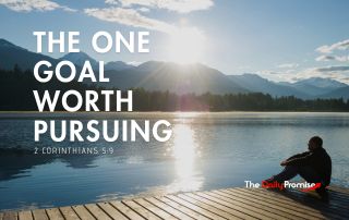 A man sitting on the dock at a mountain lake - "The One Goal Worth Pursuing"