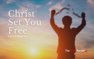 A man stands with his arms raised, breaking a chain. "Christ Set You Free" - Galatians 5:1