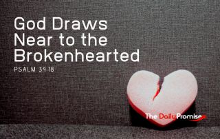 A broken, red heart is sitting on a dark gray background - God Draws Near to the Brokenhearted - Psalm 34:18